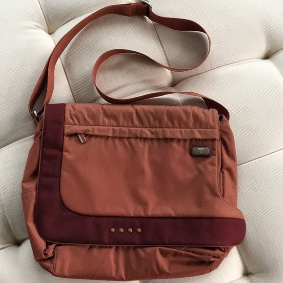 tumi tech crossbody bag